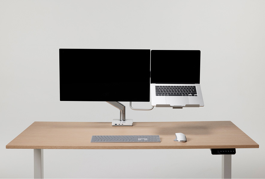 Monitor Arm and Laptop Holder combination on a desk setup